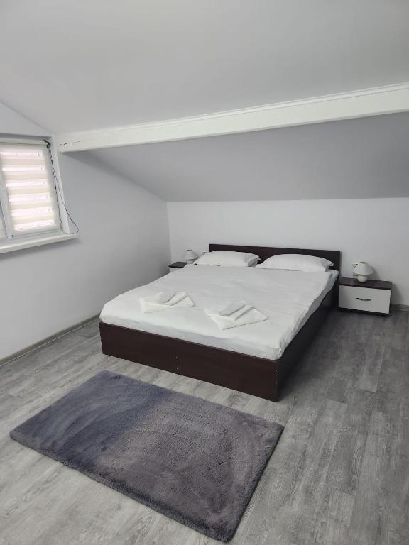Postel nebo postele na pokoji v ubytování Casa Lupeni