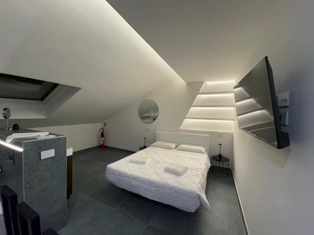 Postel nebo postele na pokoji v ubytování Ram7 Segredo Ultrassecreto Apartment Gallarate