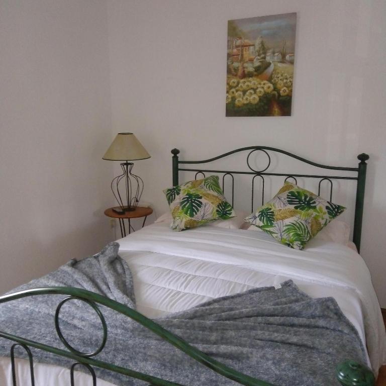 Uma cama ou camas num quarto em Terra Mista Alojamento Local