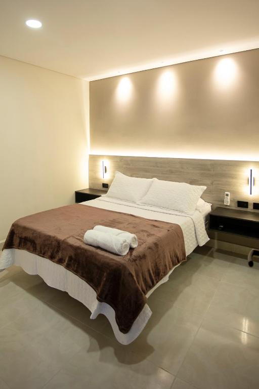 Postel nebo postele na pokoji v ubytování Hotel Gran Ester