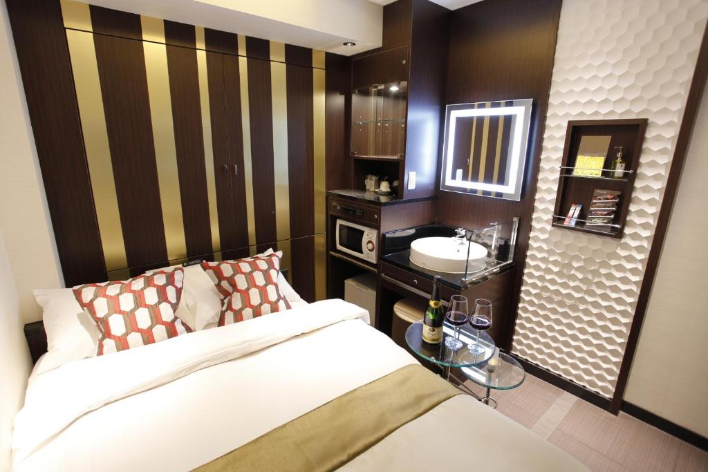 Postel nebo postele na pokoji v ubytování Hotel Moana Shinjuku (Adult Only)