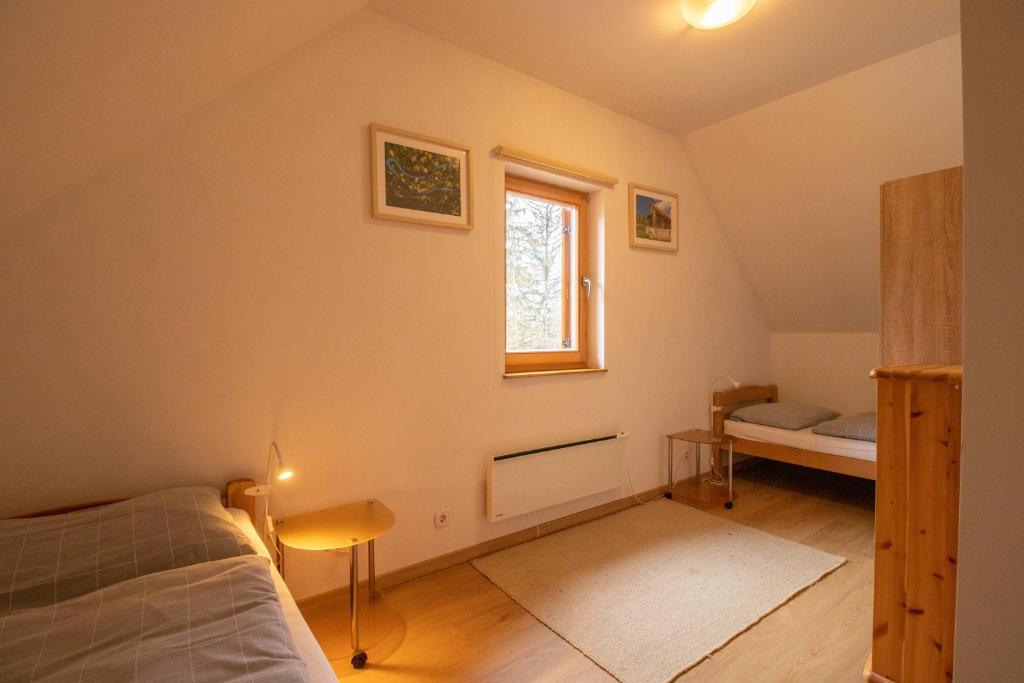 Postel nebo postele na pokoji v ubytování Chalet Fisherman's Cottage