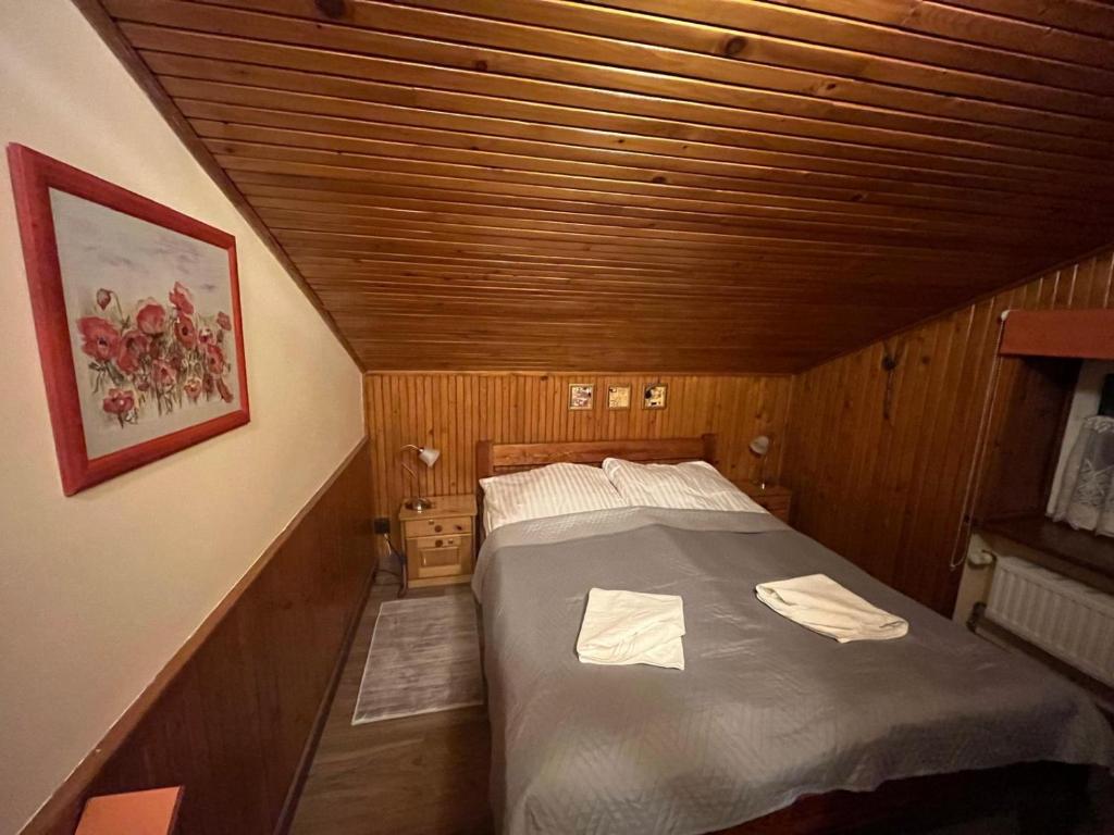 Postel nebo postele na pokoji v ubytování Willa Asia - apartamenty