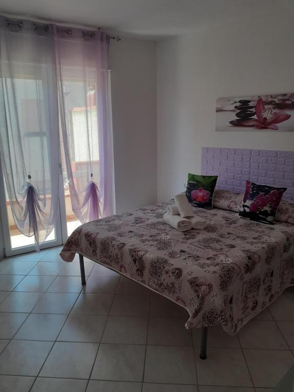 Postel nebo postele na pokoji v ubytování B&B Metalla