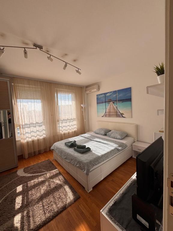 Postel nebo postele na pokoji v ubytování Belvil Belgrade