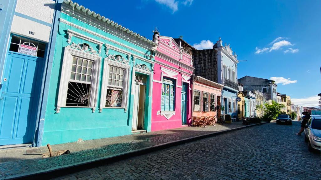 a group of colorful buildings on a street at Hostel Familiar in Salvador