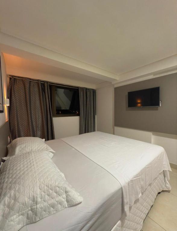 Postel nebo postele na pokoji v ubytování Manaira Apart-Hotel Confort