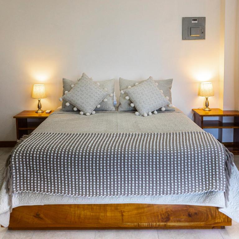 Postel nebo postele na pokoji v ubytování HOTEL AYRE By Baltra