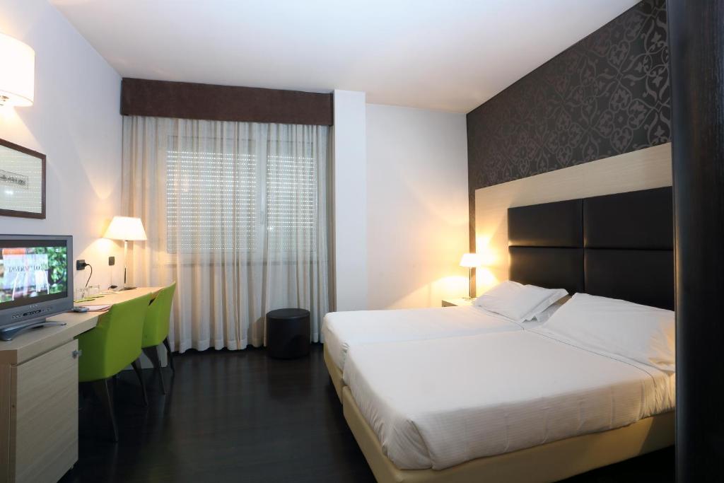 Postel nebo postele na pokoji v ubytování Hotel La Torretta