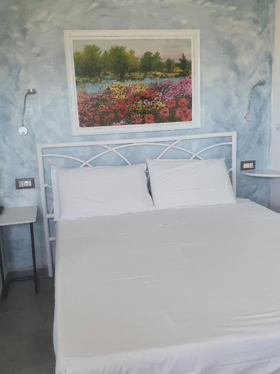 Postel nebo postele na pokoji v ubytování B&B da Nuccia Villasimius