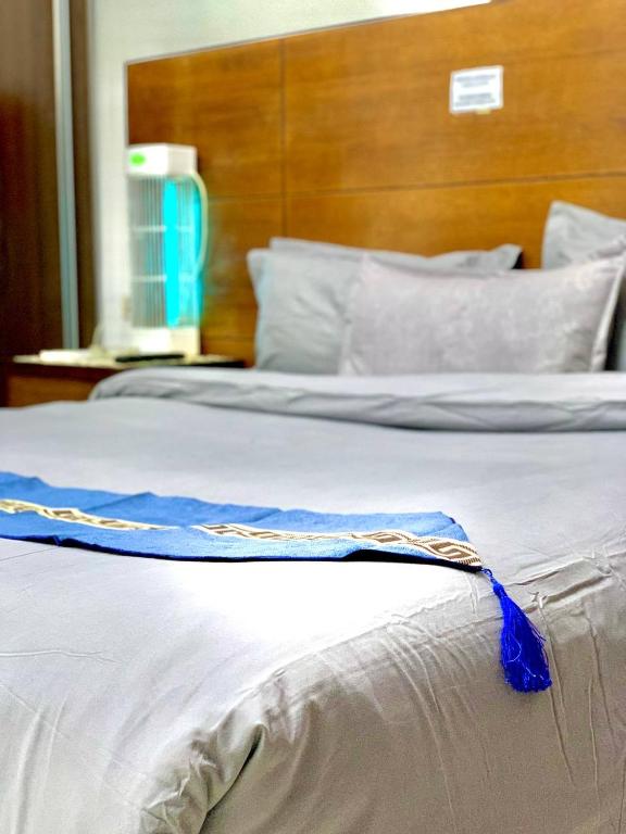 Ein Bett oder Betten in einem Zimmer der Unterkunft Amir Palace Hotel
