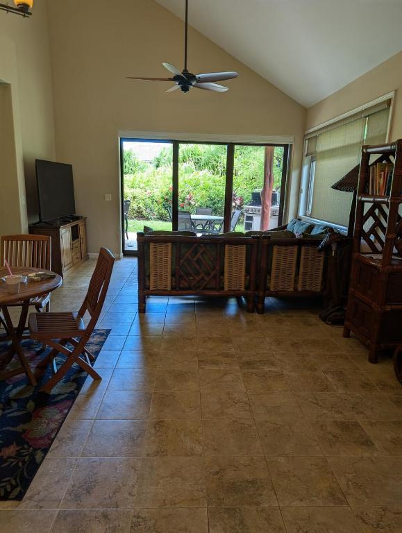 a living room with a couch and a table at 4 Bdrm House for 8 at Kamilo, Mauna Lani -- Ride Bikes or Walk To Beach in Waikoloa