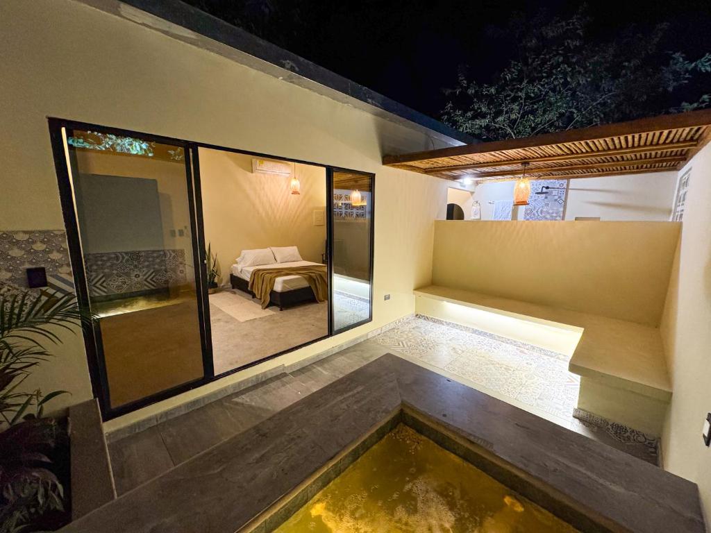 Postel nebo postele na pokoji v ubytování Cabaña Privada con Jacuzzi en la Hacienda Nápoles
