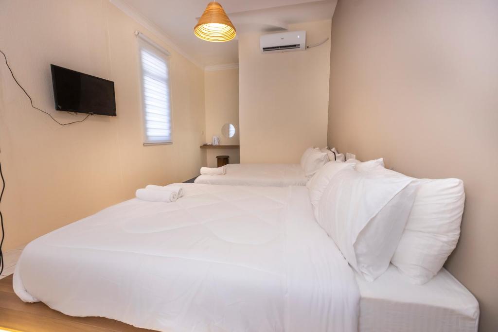 Ένα ή περισσότερα κρεβάτια σε δωμάτιο στο Bahari 58