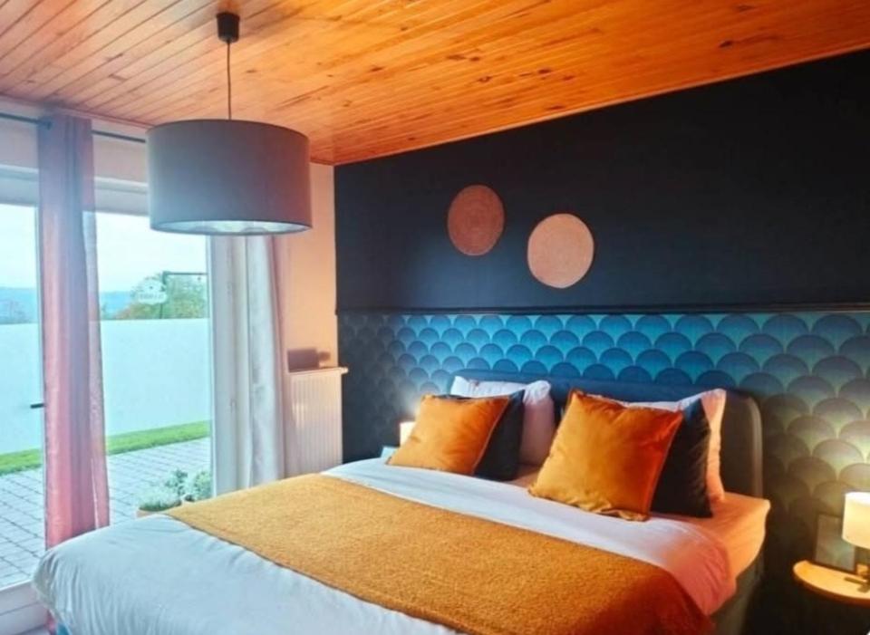 Postel nebo postele na pokoji v ubytování La nuitée à la ferme