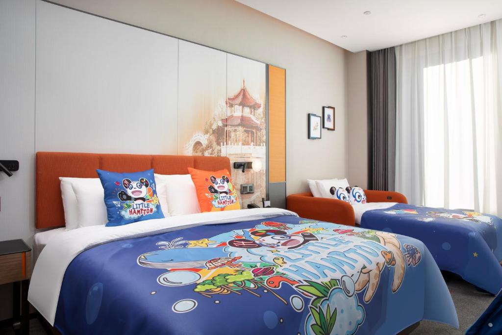 Postel nebo postele na pokoji v ubytování Hampton by Hilton Baoding High-tech Zone
