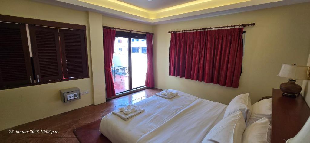 Postel nebo postele na pokoji v ubytování Nirvana Boutique Suites