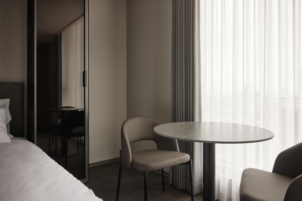 Postel nebo postele na pokoji v ubytování Homes Stay Myeongdong