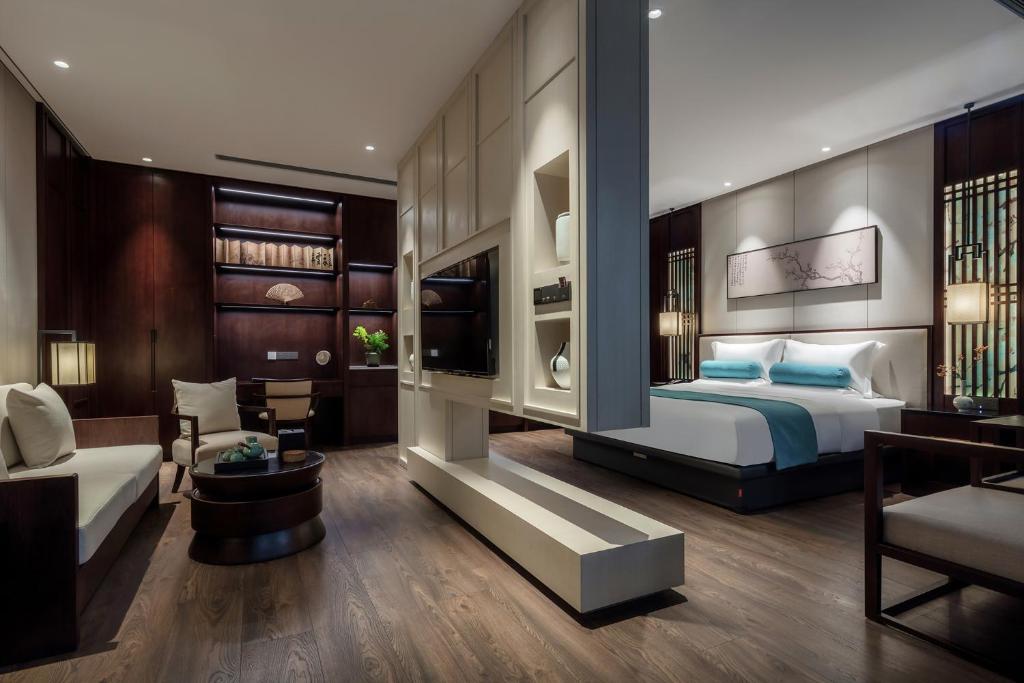 Postel nebo postele na pokoji v ubytování Xinghuacun Hotel