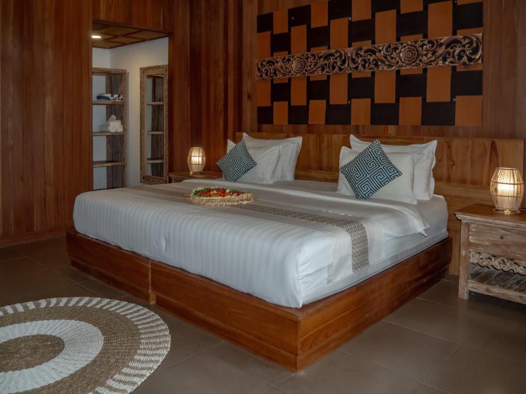 Postel nebo postele na pokoji v ubytování Tattva Ubud Retreat & Wellness