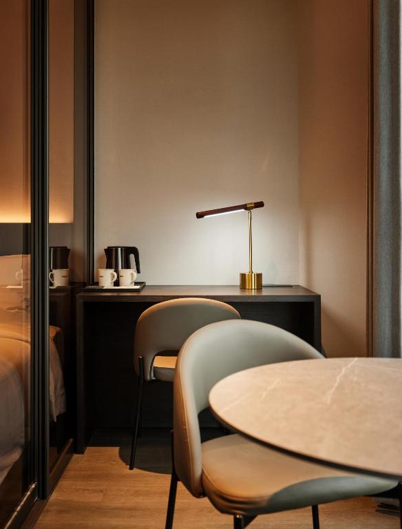 Postel nebo postele na pokoji v ubytování Homes Stay Myeongdong