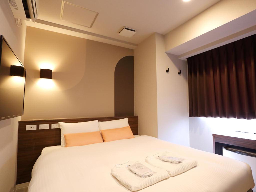 Postel nebo postele na pokoji v ubytování RE Hotel 谷町9丁目2