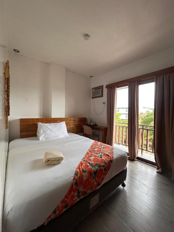 Voodi või voodid majutusasutuse Puyo Suites Homestay toas