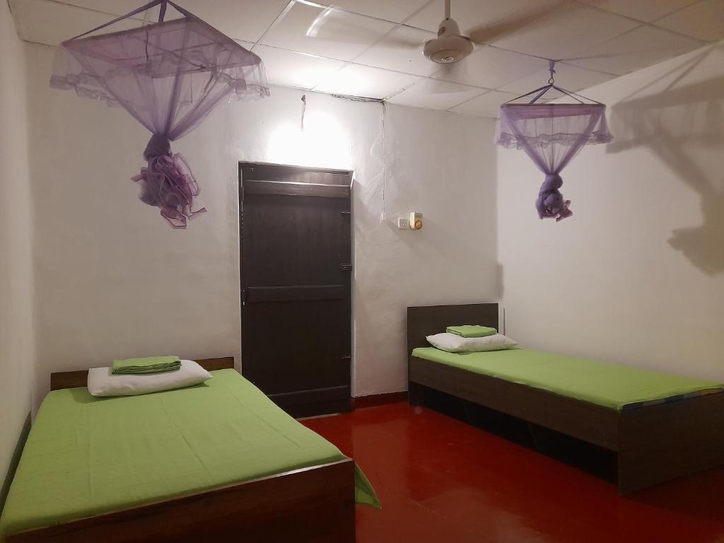Postel nebo postele na pokoji v ubytování Gloria Cottage Non AC