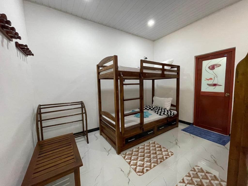 Postel nebo postele na pokoji v ubytování Sigiri Village Vibe Hostel