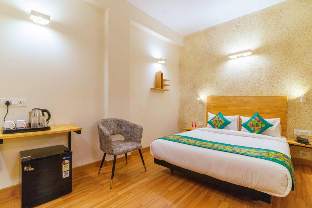Postel nebo postele na pokoji v ubytování Treebo Ace Luxe