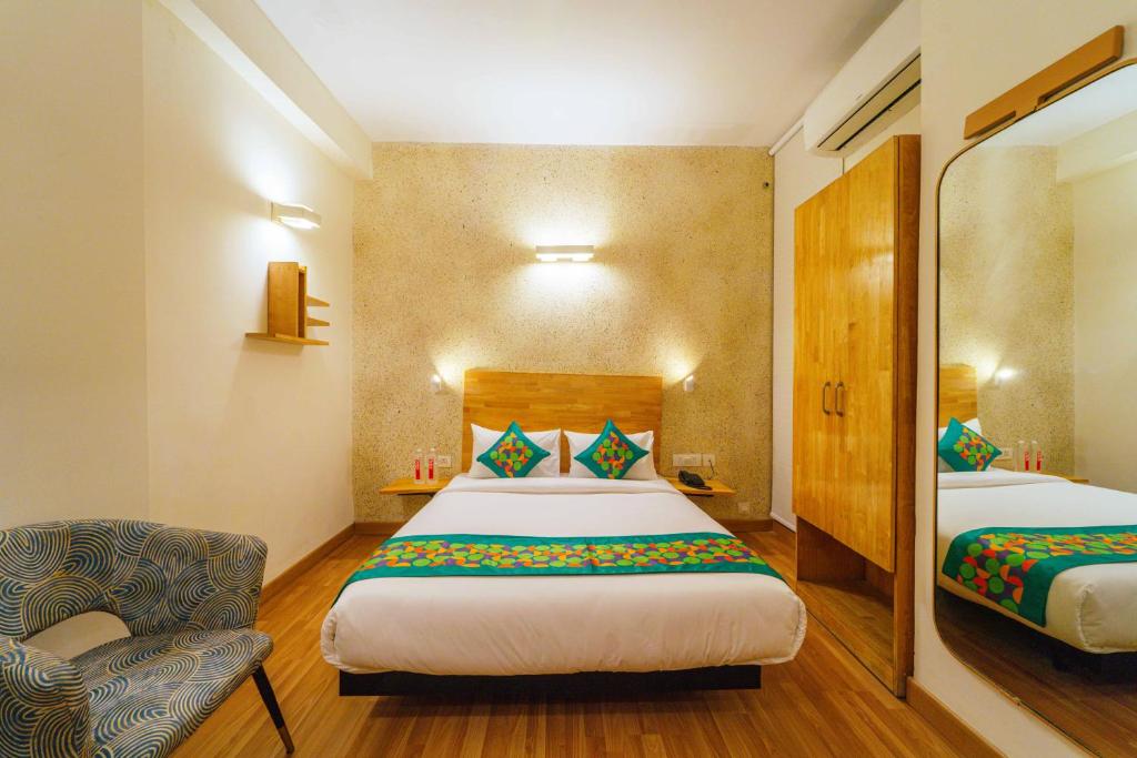 Postel nebo postele na pokoji v ubytování Treebo Ace Luxe