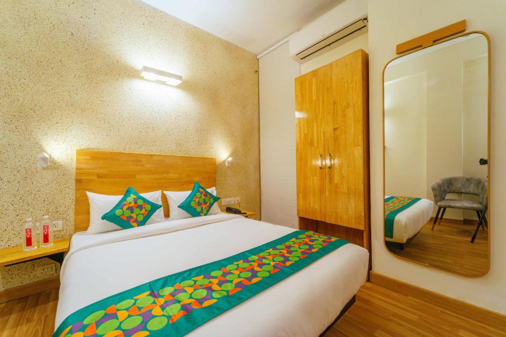 Postel nebo postele na pokoji v ubytování Treebo Ace Luxe