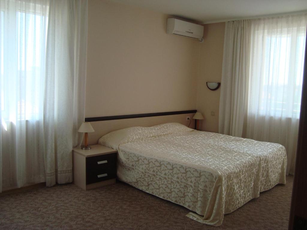 Postel nebo postele na pokoji v ubytování Hotel Astra