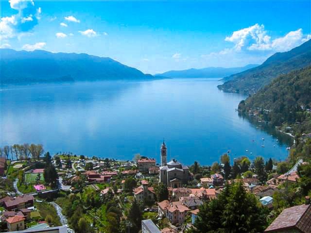 a view of a large body of water with a town at Il Pergolato in Cannero Riviera