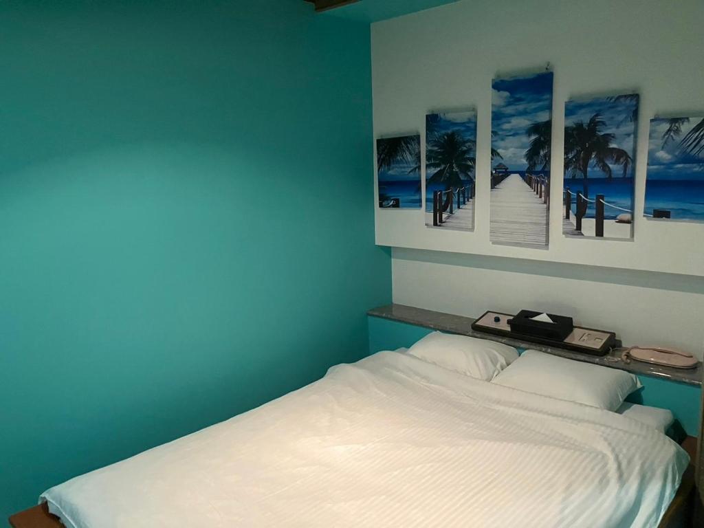 Postel nebo postele na pokoji v ubytování ホテル かくれんぼ Hotel kakurenbo