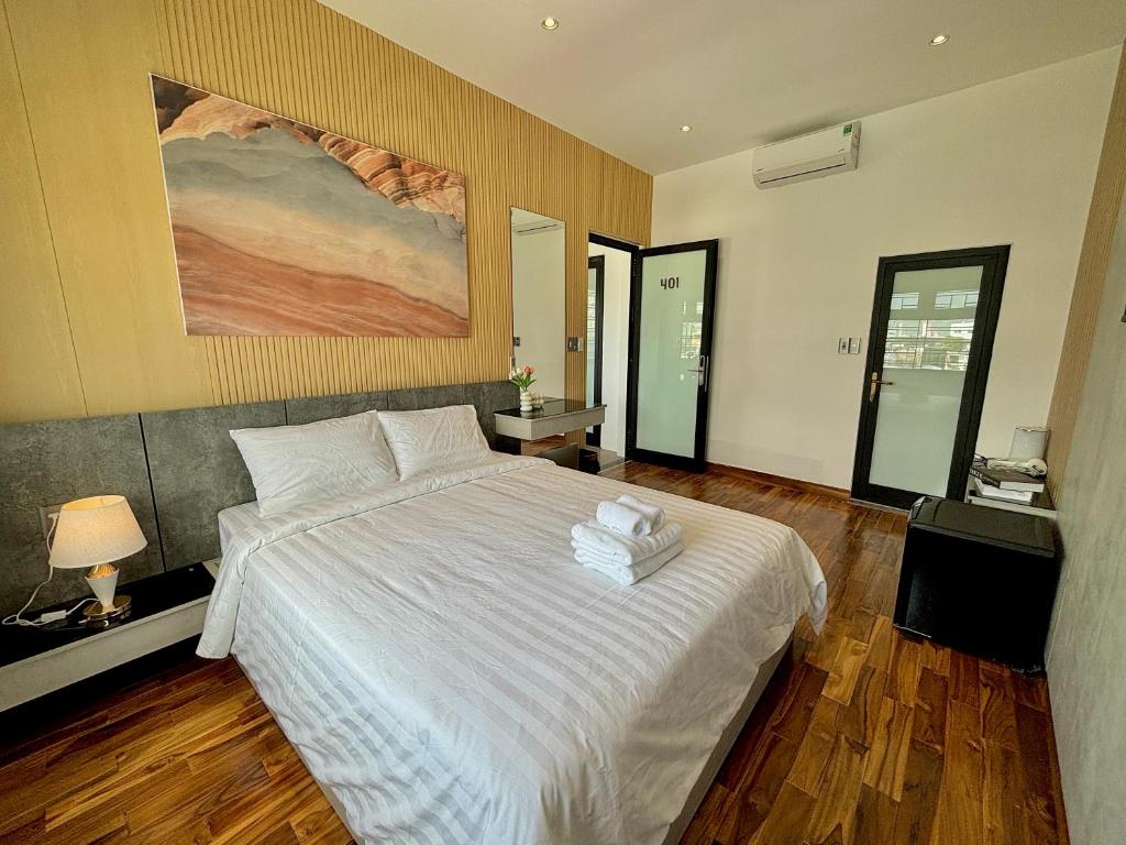 Postel nebo postele na pokoji v ubytování CEVA Hotel & Apartment Danang