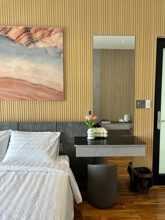 Postel nebo postele na pokoji v ubytování CEVA Hotel & Apartment Danang