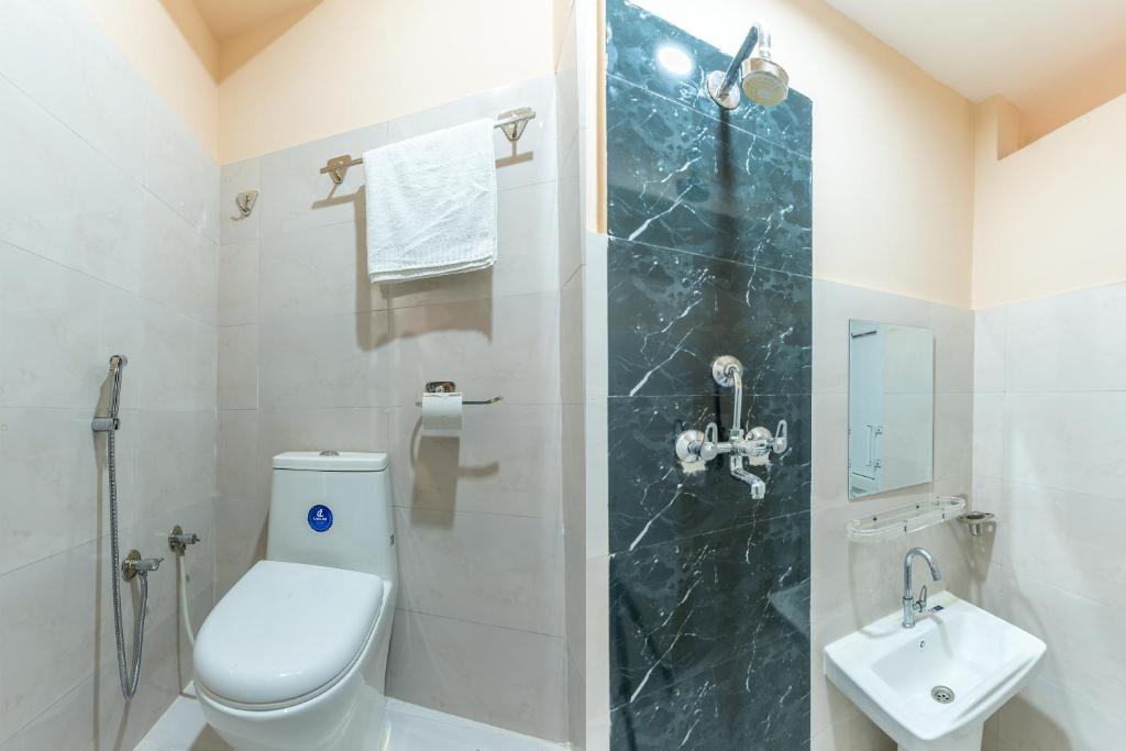 Koupelna v ubytování OYO 826 Hotel Hira Palace
