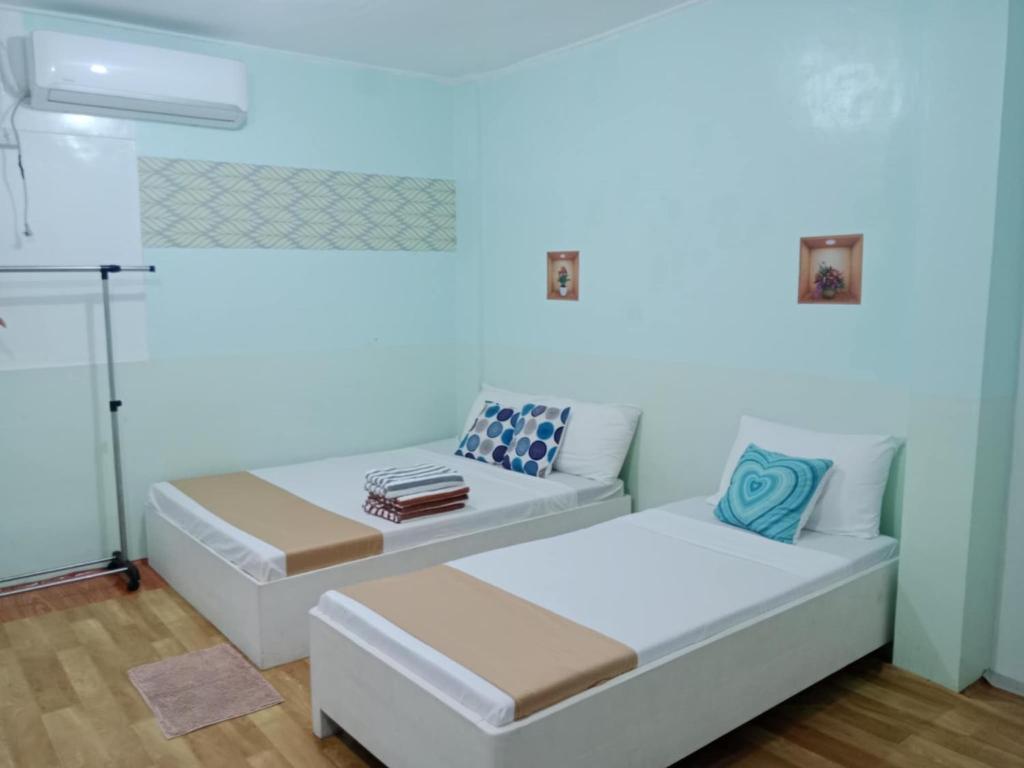 Voodi või voodid majutusasutuse Pearls Z Apartelle toas