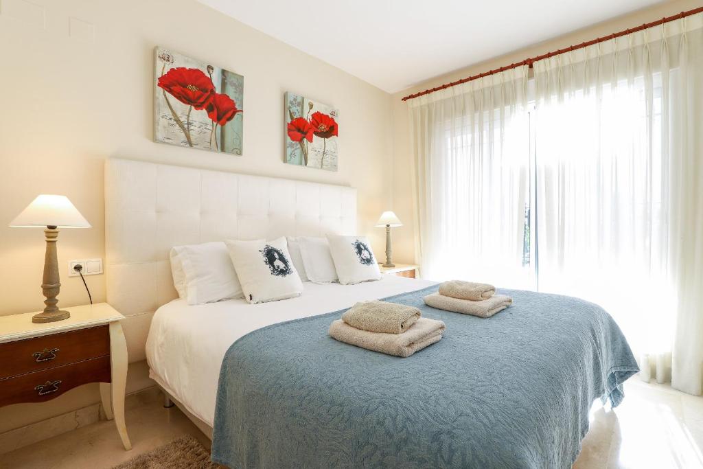 Posteľ alebo postele v izbe v ubytovaní San Pedro beachside apartment