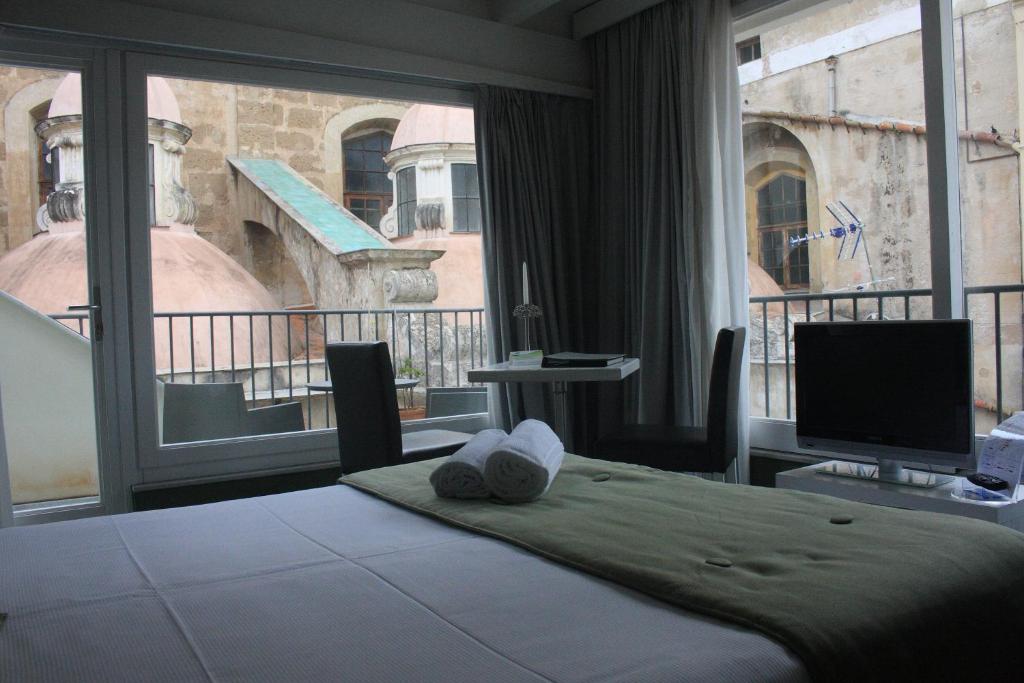 Postel nebo postele na pokoji v ubytování Quintocanto Hotel & Spa