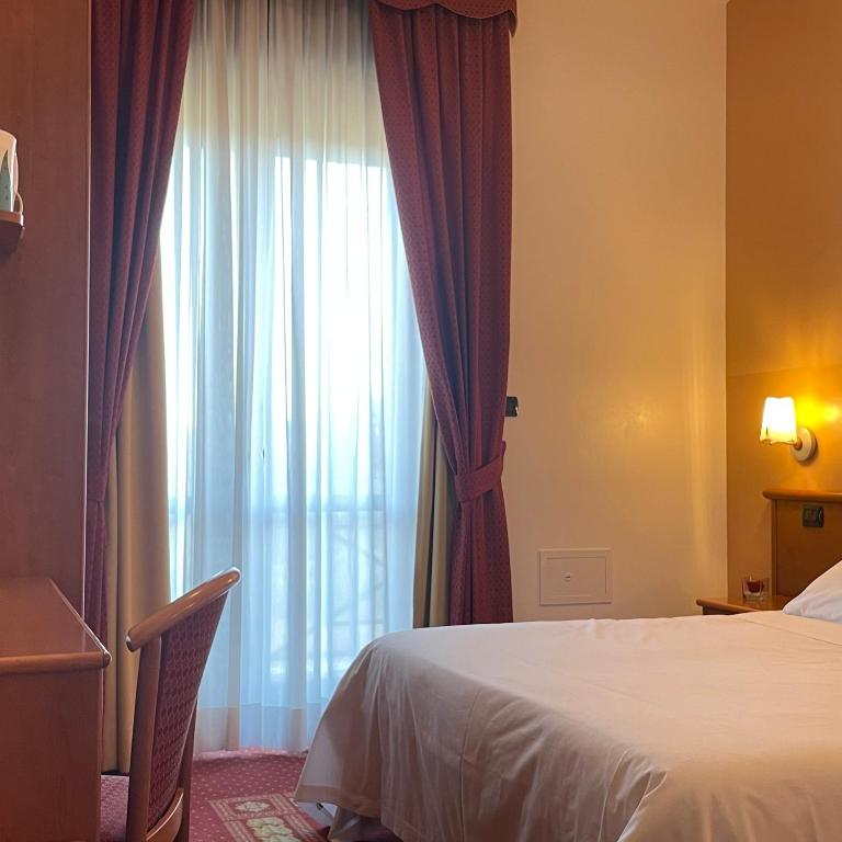 Postel nebo postele na pokoji v ubytování Vald Hotel