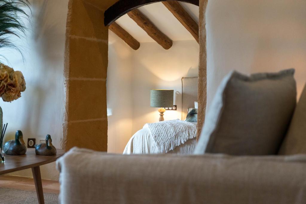 A bed or beds in a room at Reserva Rotana Golf Resort