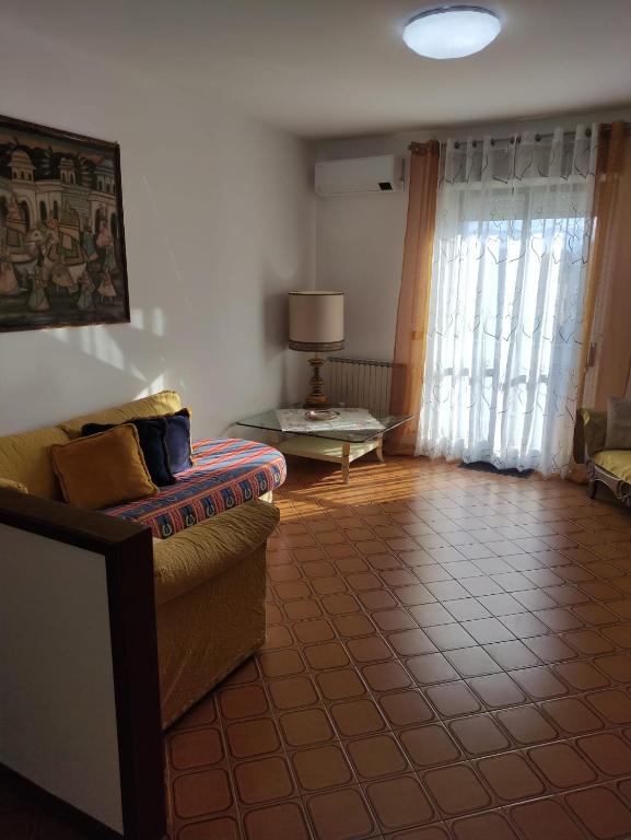 a living room with a couch and a table at Casa Manu Affittacamere in Arezzo