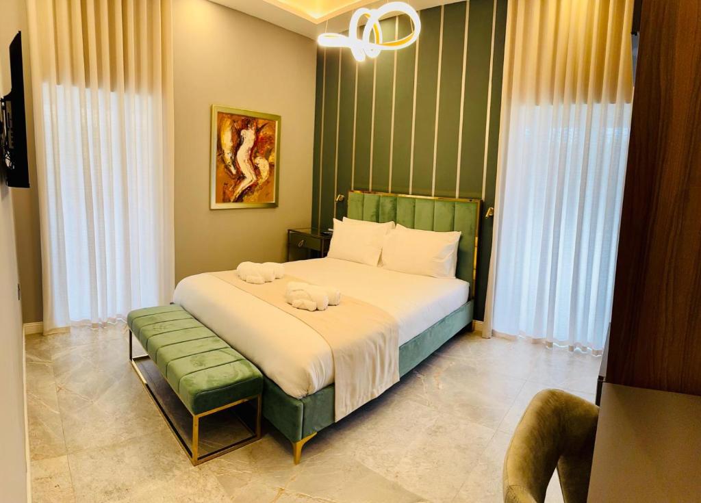 Postel nebo postele na pokoji v ubytování Howard House Hotel