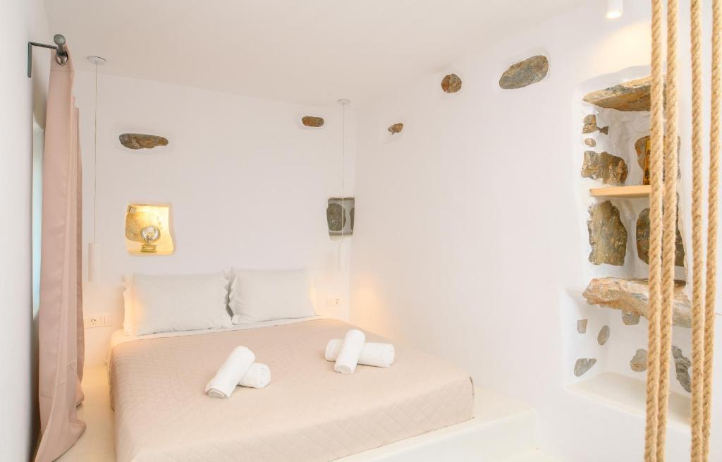 Łóżko lub łóżka w pokoju w obiekcie Idothea guest house