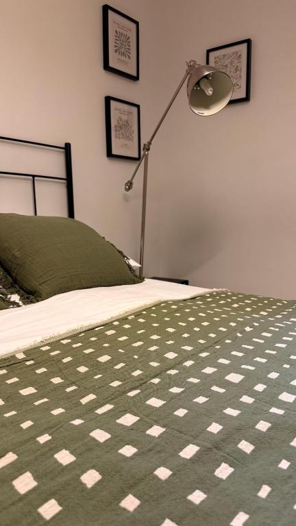 a bedroom with a bed with a lamp on it at Veratha House in Candeleda