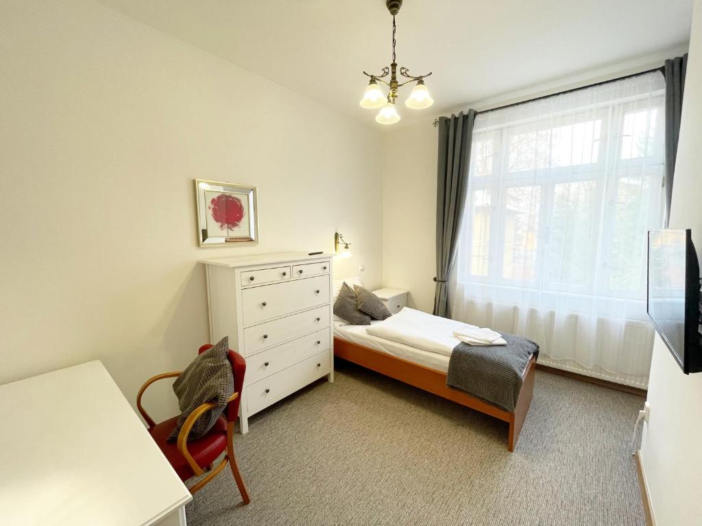 Postel nebo postele na pokoji v ubytování Apartmány Aurelius