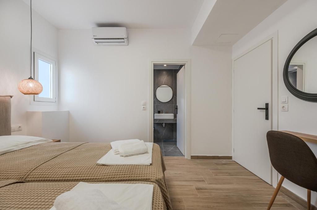 Postel nebo postele na pokoji v ubytování Mythos villas