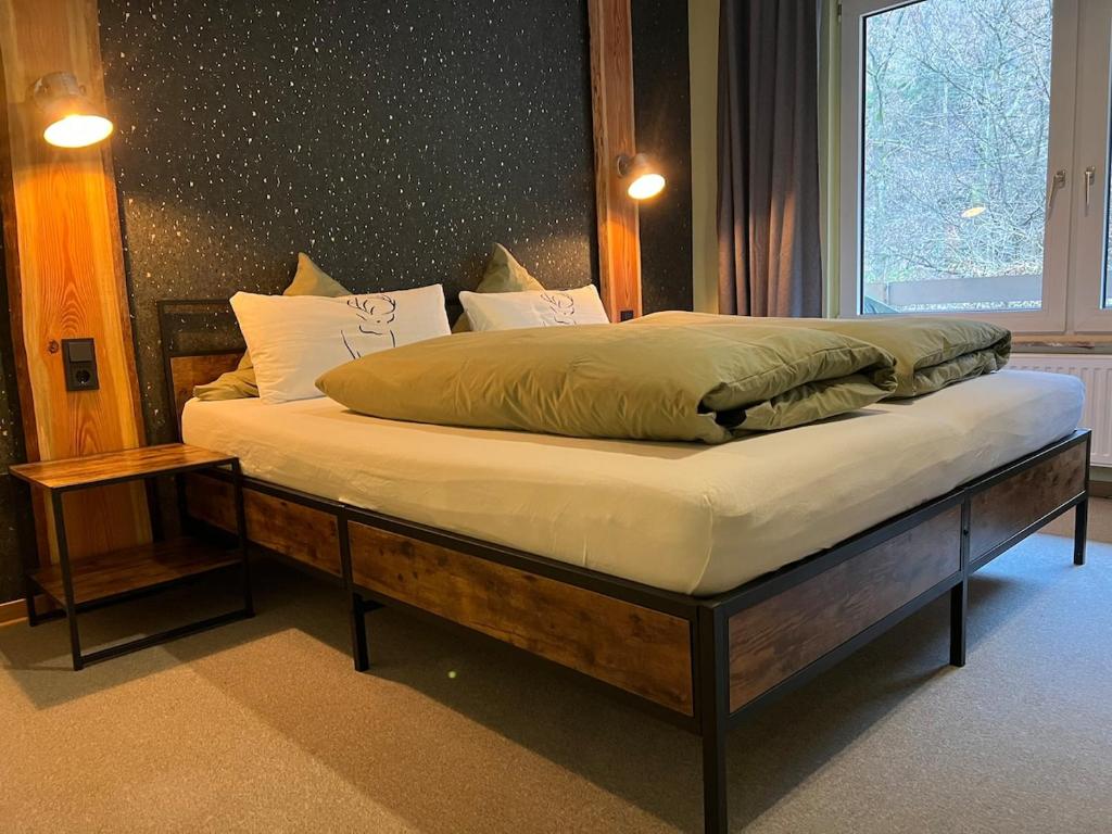 Postel nebo postele na pokoji v ubytování Vor lauter Bäumen B&B